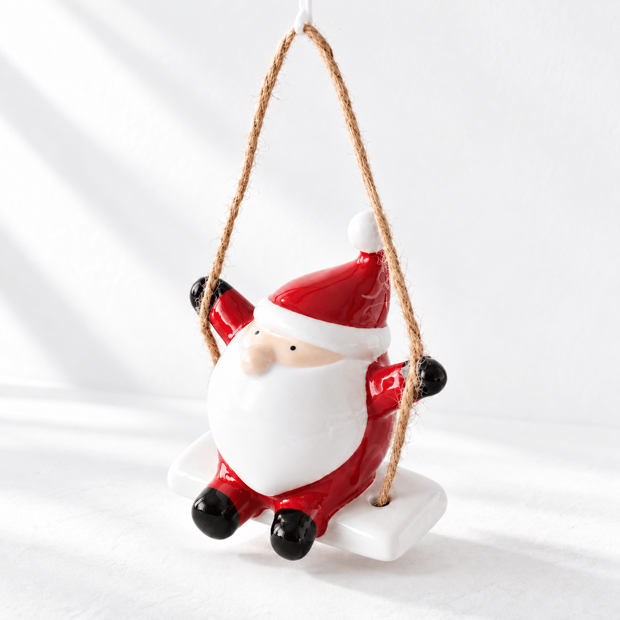Ceramic Santa on a Swing